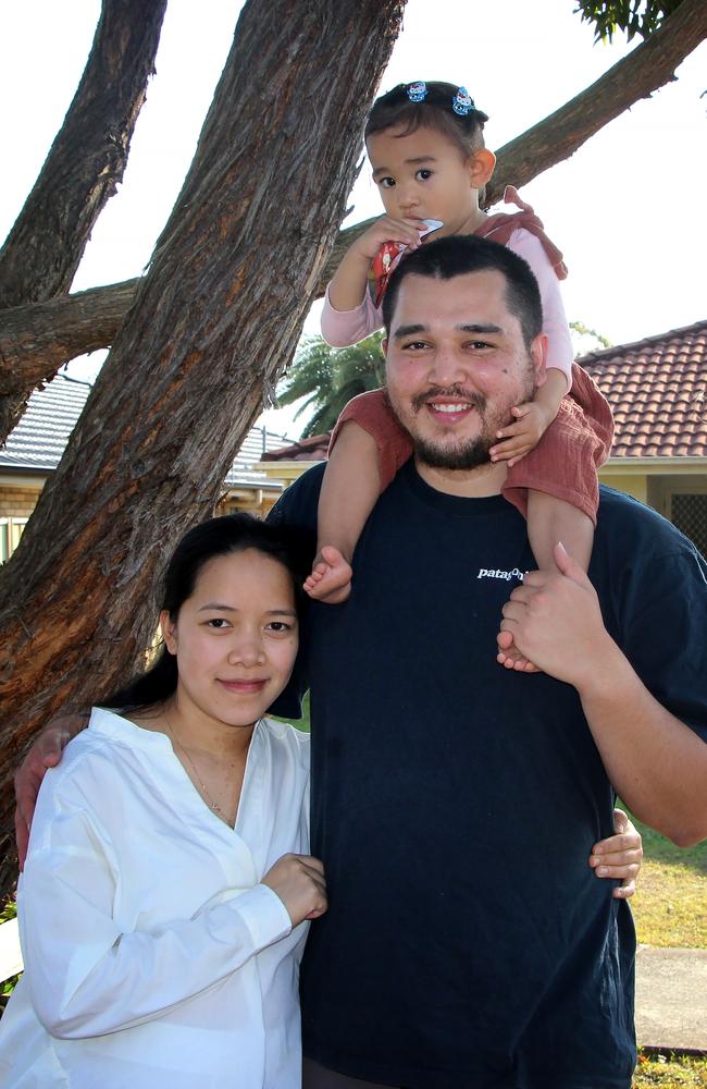 First home buyers Steven (28) and Angelica (26) Harrison with their daughter Harmonica (2) at their new home in San Remo. Picture: Fiona Killman