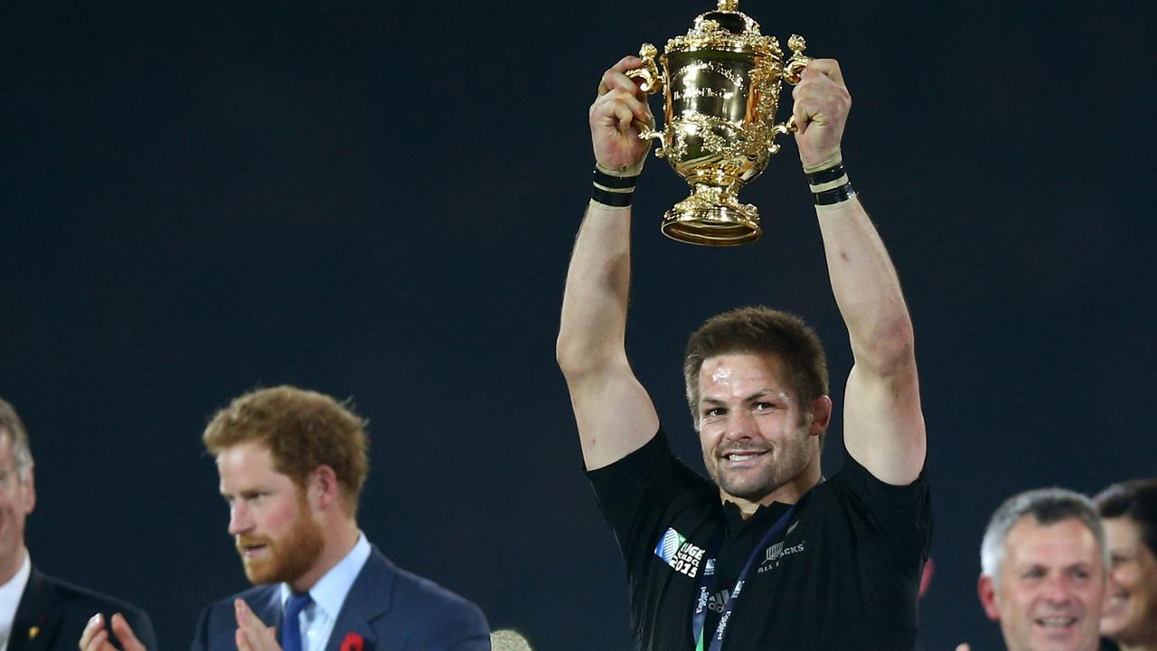 After 34 years Richie McCaw finally lifts the World Cup for the New Zealand for the second time. Picture: Paul Gilham/Getty Images