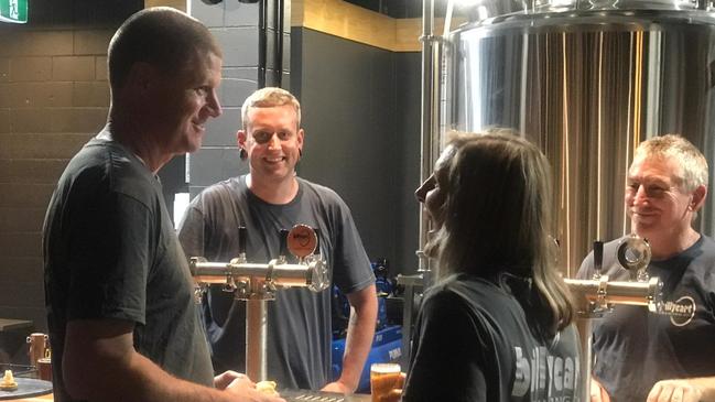 Matt Bradford and Margaret Barker chat with staff at BillyCart Brewery at Atherton. Picture: Supplied.