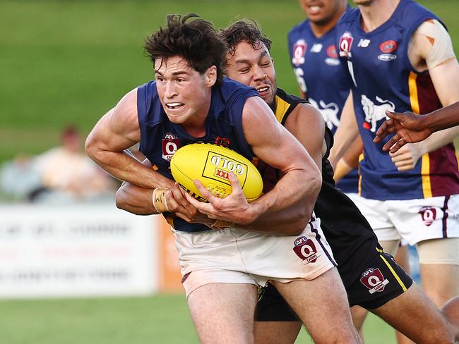 Lions' Daniel Charlesworth is tackled in the AFL Cairns premiership men's preliminary final match between the Cairns City Lions and the North Cairns Tigers, held at Cazalys Stadium, Westcourt.. Picture: Brendan Radke