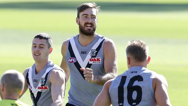 The inclusion of Charlie Dixon, centre, didn’t help Kane Cornes’ SuperCoach team in Round 3.