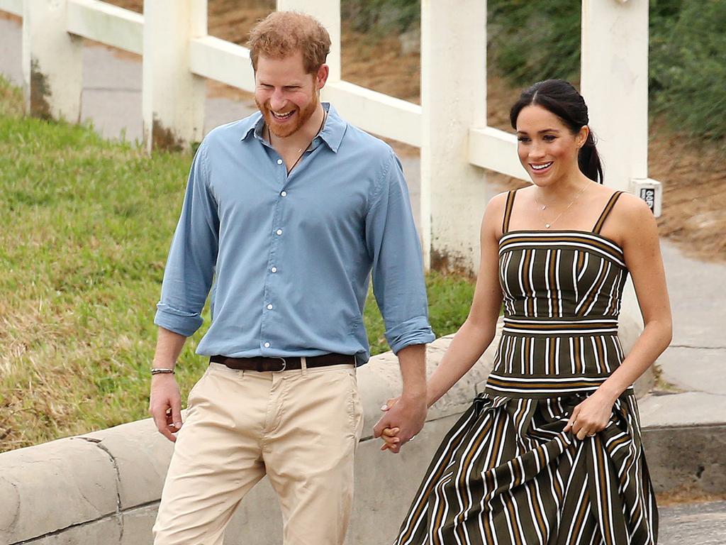 DAILY TELEGRAPH - Pictured is the Duke and Duchess of Sussex, Prince Harry and wife Meghan at Bondi Beach today on their Royal tour of Australia. Picture: Tim Hunter
