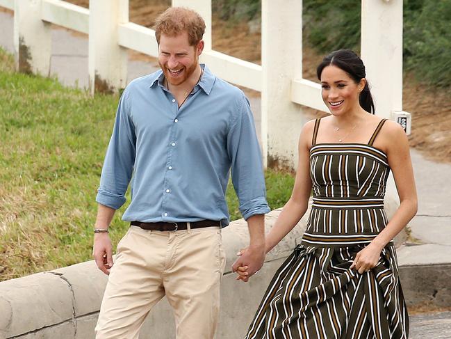DAILY TELEGRAPH - Pictured is the Duke and Duchess of Sussex, Prince Harry and wife Meghan at Bondi Beach today on their Royal tour of Australia. Picture: Tim Hunter
