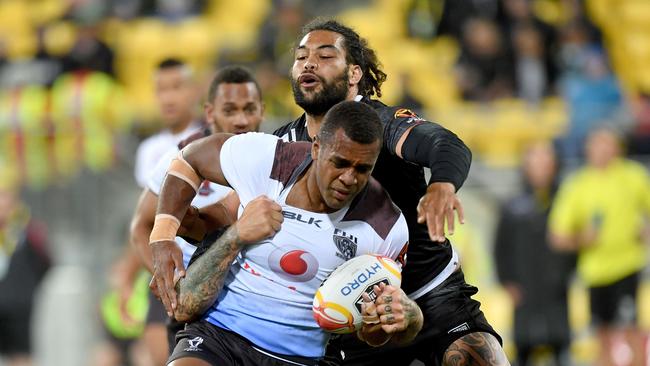 Fiji's Ben Nakubuwai is tackled by New Zealand's Russell Packer and Adam Blair in a 2017 Rugby League World Cup quarter-final in Wellington. Picture: AFP Photo/Marty Melville