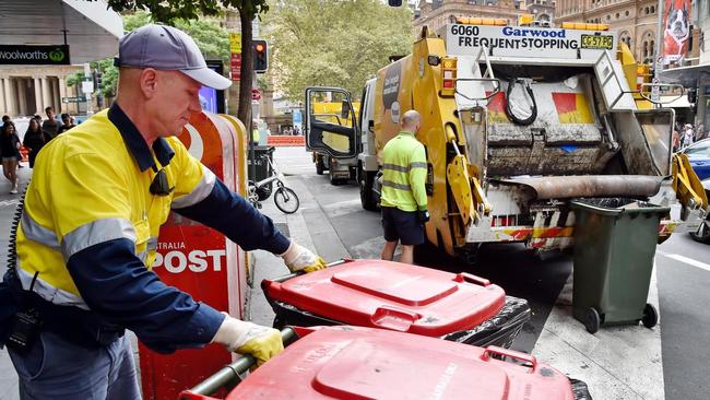 Bin collectors across Sydney have been affected by Covid-19 and close-contact isolation requirements, throwing services into disarray and putting a strain on staff. Generic image of rubbish collectors.