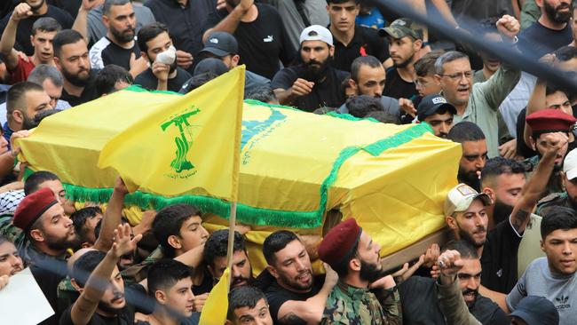 People take part in the funeral procession of Ibrahim Aqil. Picture: AFP.