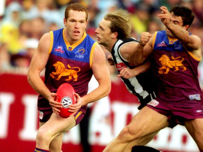 Justin Leppitsch and Chris Scott in Brisbane’s 2002 Grand Final win.