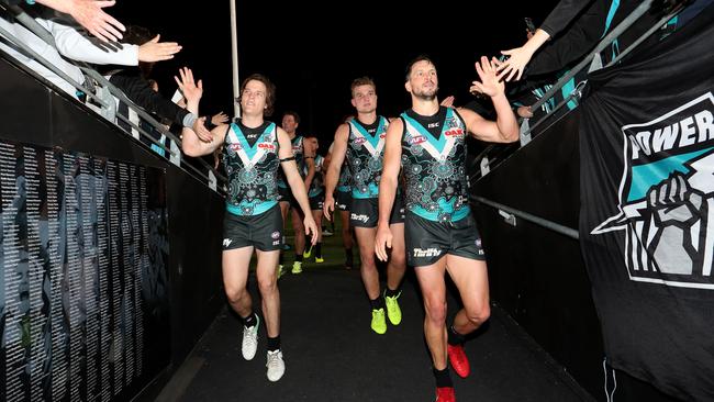 Jared Polec, Ollie Wines and Travis Boak after the Power’s victory against Richmond. Picture: James Elsby/AFL Media/Getty Images