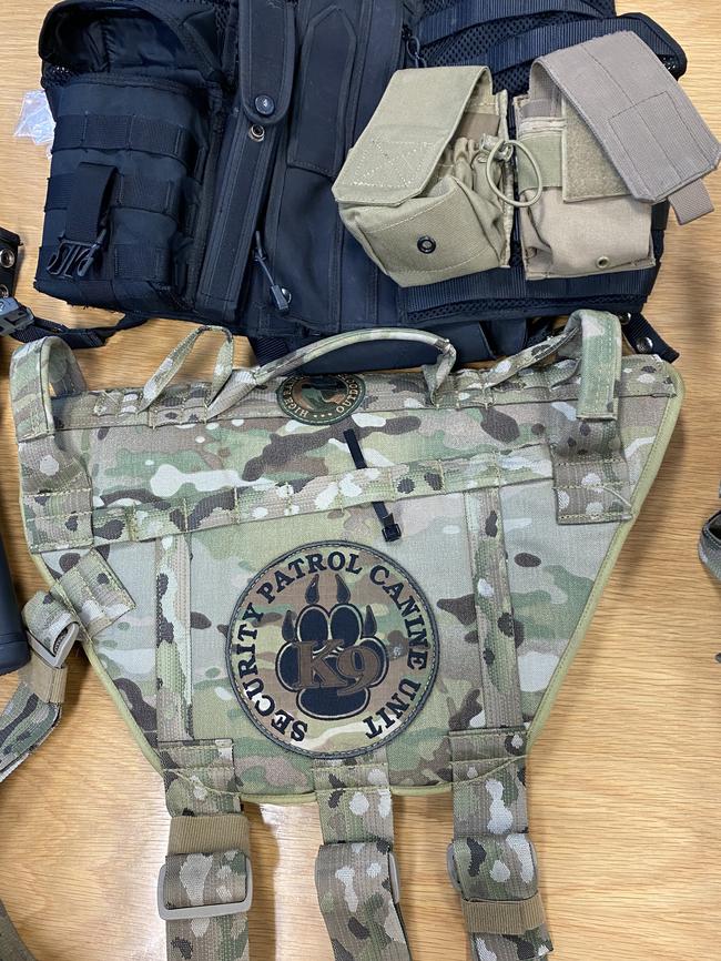 Items seized from Dominic Fox included police and army paraphernalia, gel blasters, fake guns made from moulds, badges, K9 vest, working handcuffs and a retractable baton