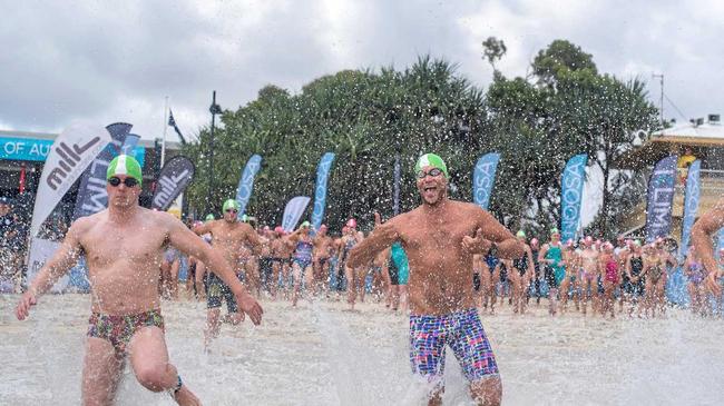 MAIN EVENT: Competitors race in to the water as part of the Noosa Summer Swim.