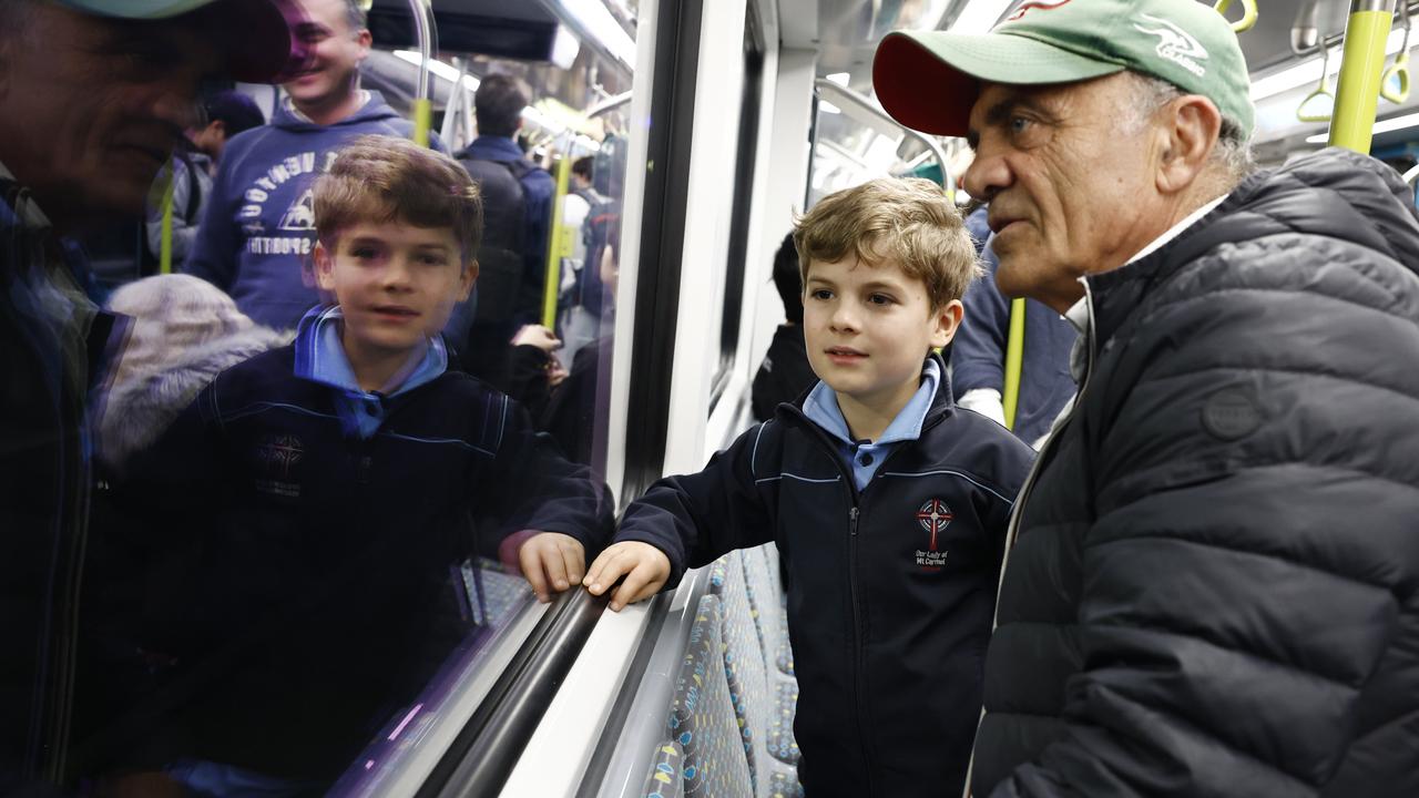 Pictured is on a Sydney Metro carriage is Adam Riakos and his grandfather Mosh Riakos. They were among the first passengers on the brand new Sydney Metro on its maiden run to Tallawong at 4.54am. Picture: Richard Dobson