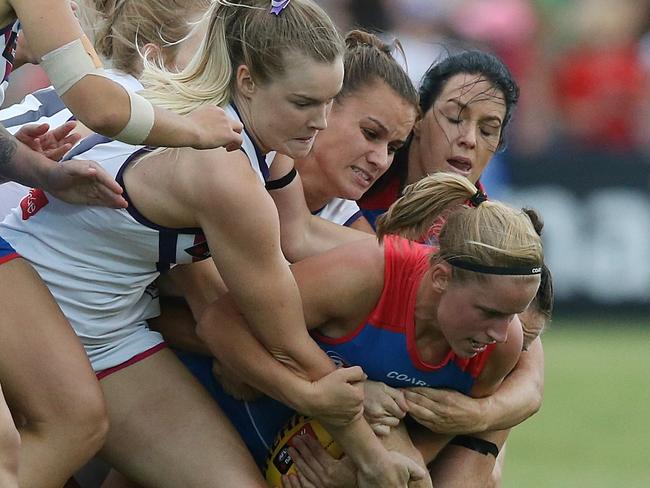 Jaimee Lambert is tackled by four Fremantle players. Picture: Wayne Ludbey