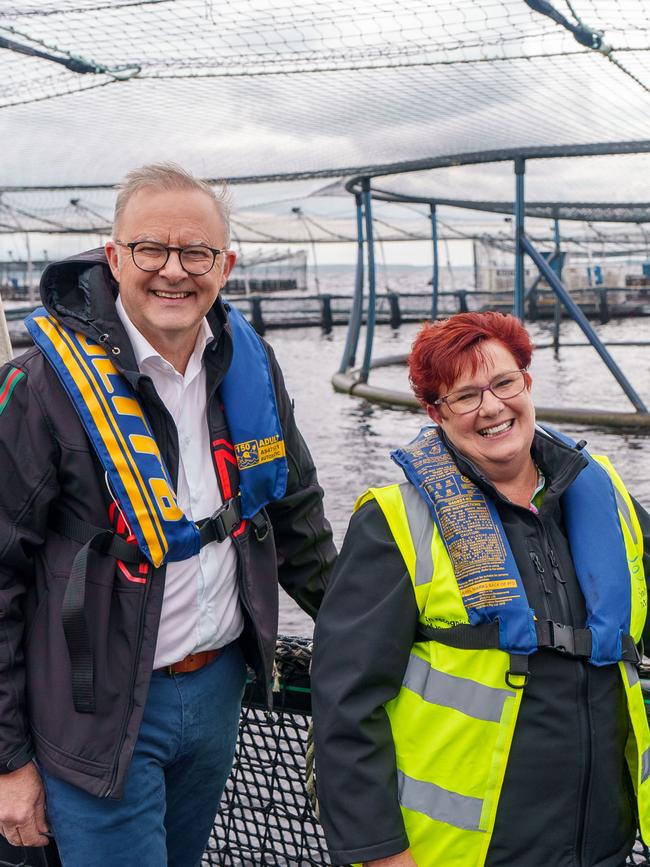 Prime Minister Anthony Albanese and Tasmanian Senator Anne Urquhart during a visit to the Tassal salmon pens in Strahan, last year. This visit pre-empted his promise to enact legislation that would “ensure appropriate environmental laws are in place to continue sustainable salmon farming in Macquarie Harbour”. Picture: POOL/NewsWire