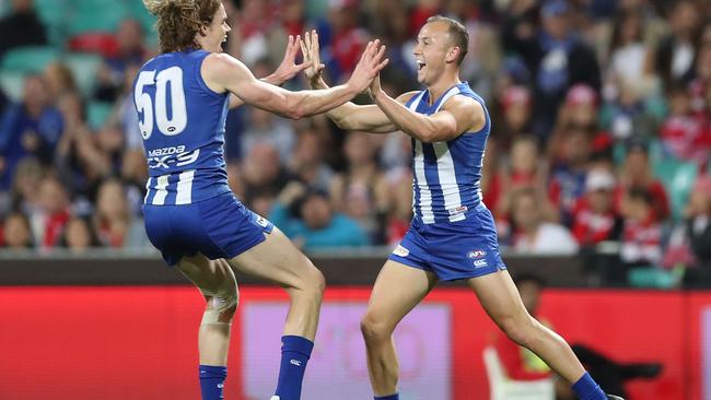 Billy Hartung (right) of the Kangaroos celebrates with Ben Brown in an AFL match in 2018. (Photo by Mark Metcalfe/Getty Images)