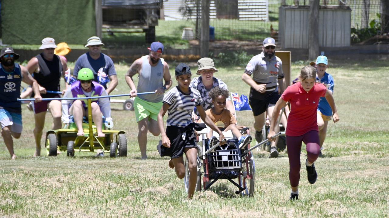 Early leaders in the Great Australia Day Dunny Race, Camper Crapper, lead the field on the banks of Oakey Creek at Arthur Shooter Park.