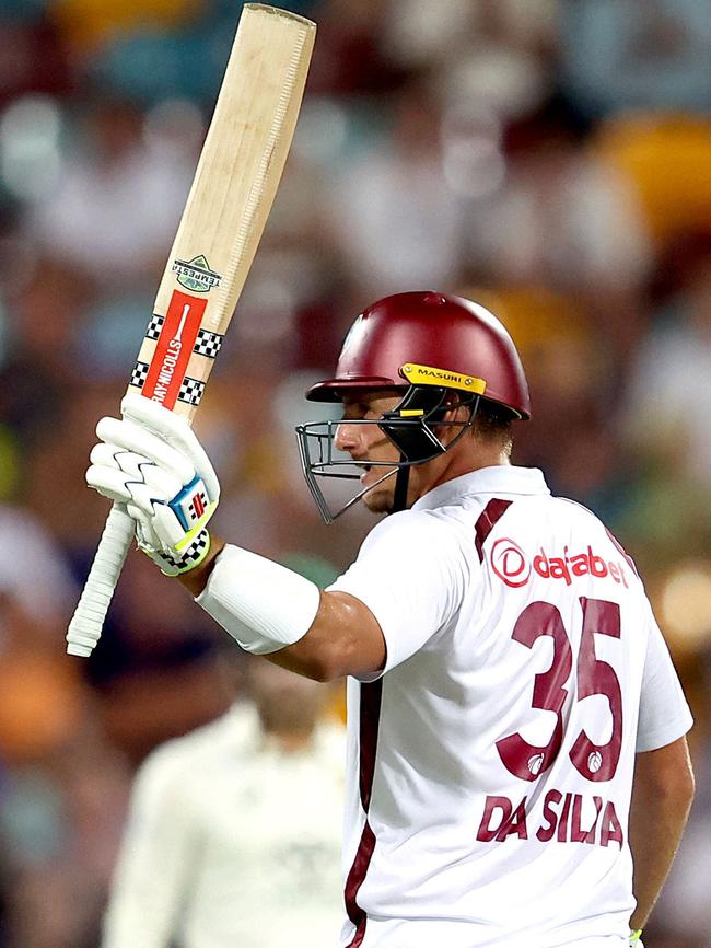 Joshua Da Silva celebrates reaching 50 runs. (Photo by Pat Hoelscher / AFP)