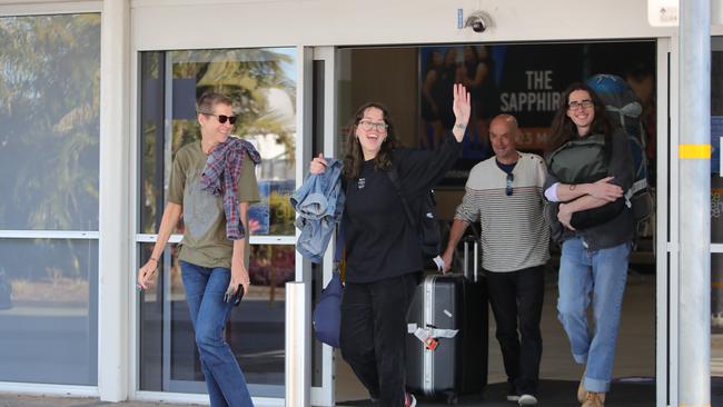 Passengers who arrived on a plane from Melbourne this afternoon leaving the Gold Coast Airport under their own steam.. Picture Glenn Hampson.