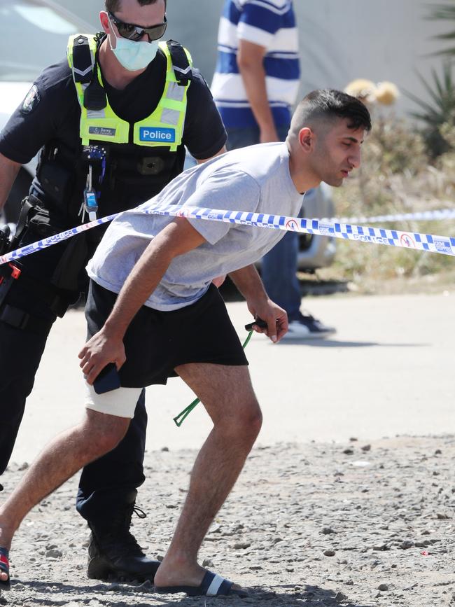 A man injured in the shooting was at the scene. Picture: David Crosling