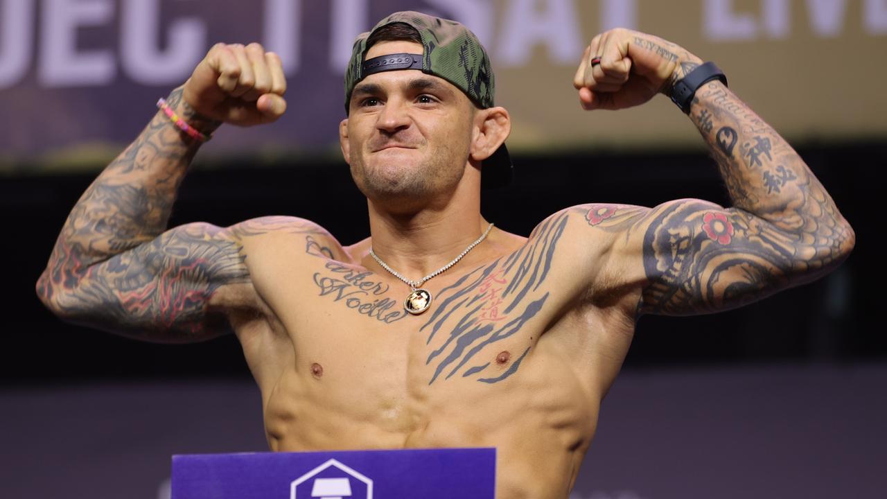 Dustin Poirier poses on the scale during the UFC 269 ceremonial weigh-in. Carmen Mandato/Getty Images/AFP