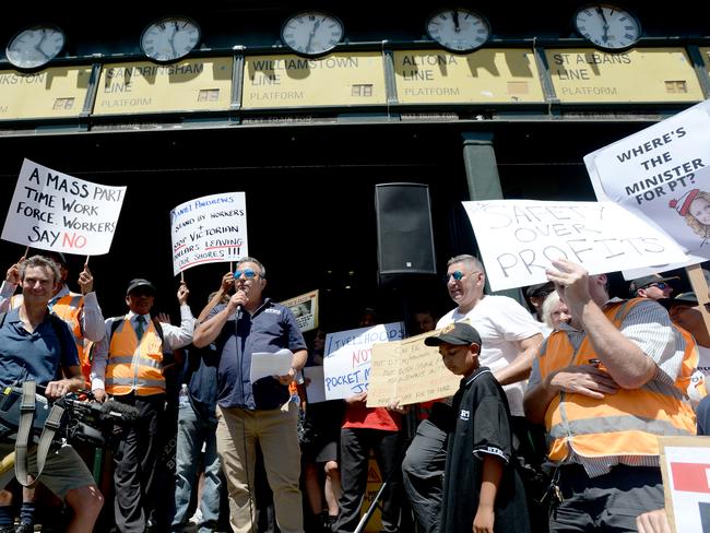 Public transport staff hold a stop-work meeting outside Flinders Street Station. Picture: Andrew Henshaw