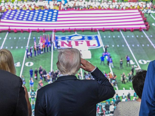 US President Donald Trump salutes as the national anthem is played. Picture: AFP