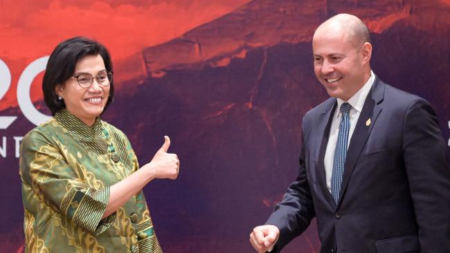 Indonesia's Finance Minister Sri Mulyani Indrawati (L) gestures to Australia's Treasurer Josh Frydenberg during their bilateral meeting on the sidelines of the G20 finance ministers and central bank governors meeting in Jakarta on February 17, 2022. (Photo by BAY ISMOYO / POOL / AFP)