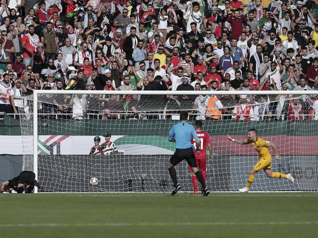 Australia's forward Jamie Maclaren celebrates after scoring his teams first goal during the AFC Asian Cup group B soccer match between Australia and Palestine at Rashid Stadium in Dubai, United Arab Emirates, Friday, Jan. 11, 2018. (AP Photo/Nariman El-Mofty)