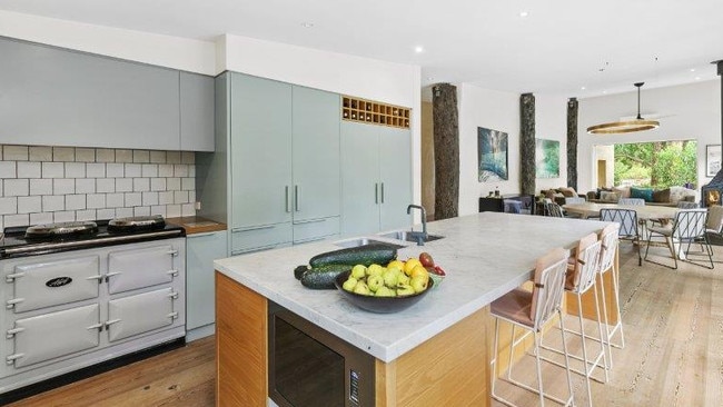 Recycled old Geelong pier posts combine form and function in the open-plan living area.