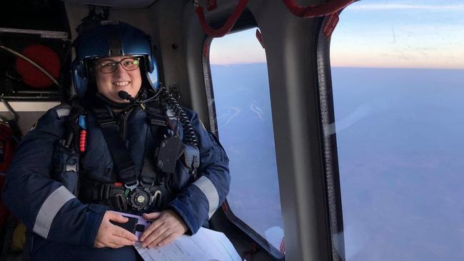 Airborne: Flight nurse Nadine Tipping pictured in the CareFlight helicopter on the way to a job. She is based in Darwin and has responded to crisis in Australia and the Pacific. Picture: Supplied