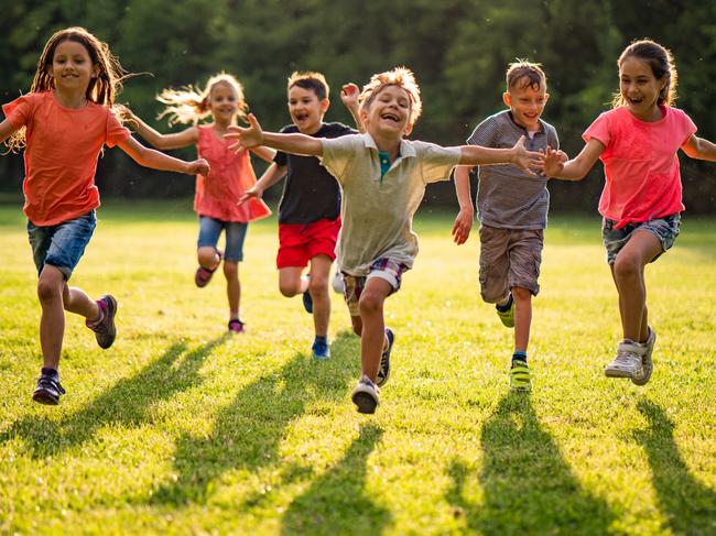 CHILDREN NATURE -  Group of beauty kids running to camera in public park Picture: Istock