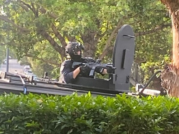 A police officer with an assault rifle in Mosman. Picture: Mosman Collective