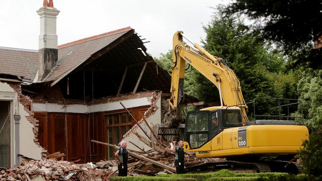 Stonnington Council officers inspect the demolition of a mansion, once owned by the owner of builder LU Simon, at 16 St Georges Rd, Toorak.