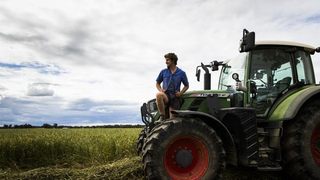 Josh Feuerherdt, son of Steven, cutting grass that is greener than needed for hay. Picture: Dylan Robinson