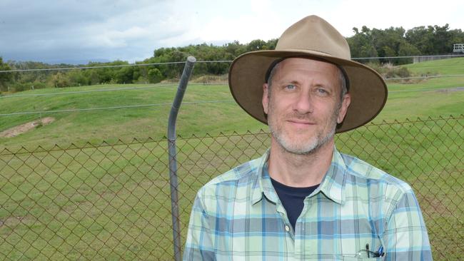 Senior Project Manager John Hart near Byron Shire Council's wastewater treatment plant at the Byron Wetlands. Behind him is the site where the council hopes to build a major bioenergy facility.