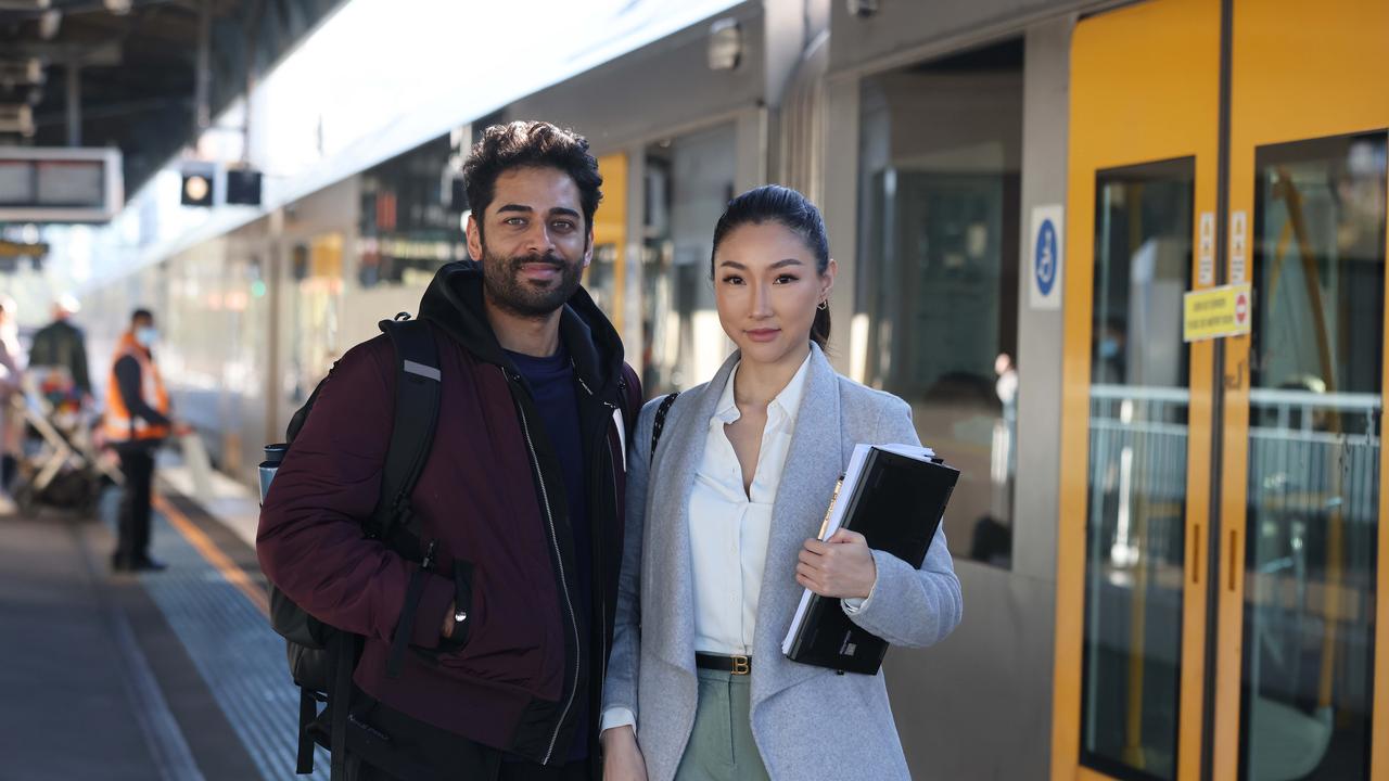 Commuters on public transport seem split on wearing masks. Deepak Sharma and Annie Pang wear them occasionally. Picture: David Swift