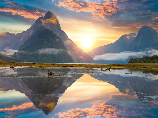 Famous Mitre Peak rising from the Milford Sound fiord. Fiordland national park, New Zealand