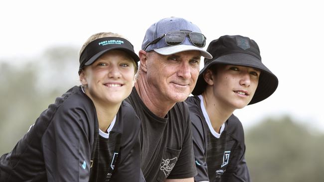 Former Port Adelaide SANFL star Roger Delaney with his children Jada and Cooper, who are both 13, at the Power’s pre-season camp in Maroochydore. Picture: Sarah Reed