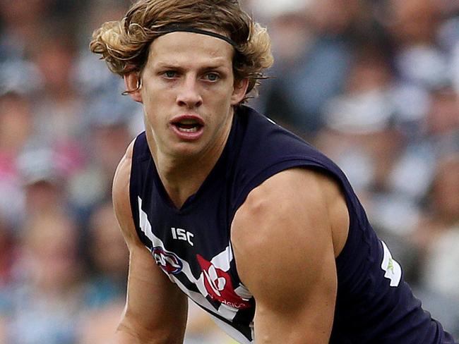 AFL Round 2 - Geelong v Fremantle at Simonds Stadium, Nat Fyfe gets away from Joel Selwood. 12th April 2015. Picture: Colleen Petch.