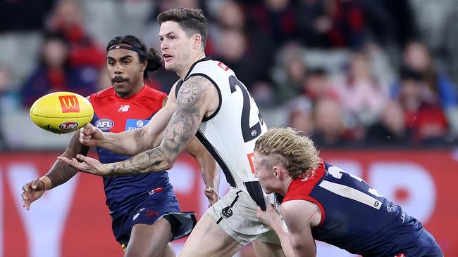 Jack Crisp fires out a handpass in the win over the Demons. Picture: Mark Stewart