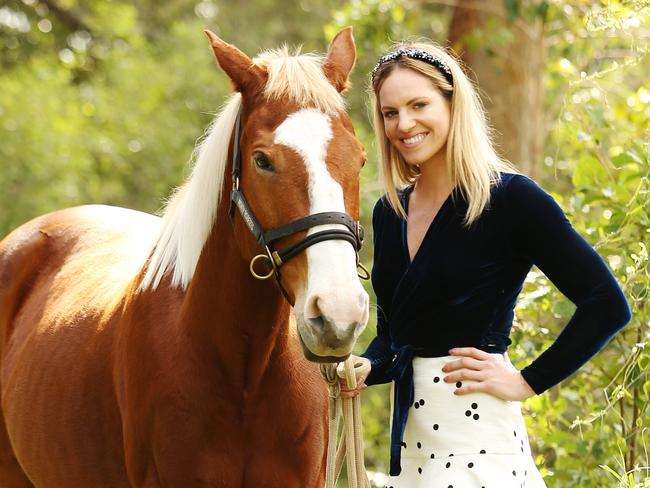 Emily Seebohm photographed with Emily's horse Platinum. Emily and Mitch Larkin will be attending Darley Kingsford Smith Cup Day on Saturday 27 May with their families, as their last social outing before they fly out with the Dolphins swim team to the FINA World Championships.Photo: Claudia Baxter