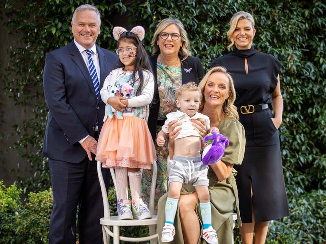 Channel 7 newsreaders Peter Mitchell and Rebecca Maddern, Good Friday Appeal chairman Penny Fowler and Good Friday Appeal executive director Rebecca Cowan with Aru and Arlo. Picture: Mark Stewart