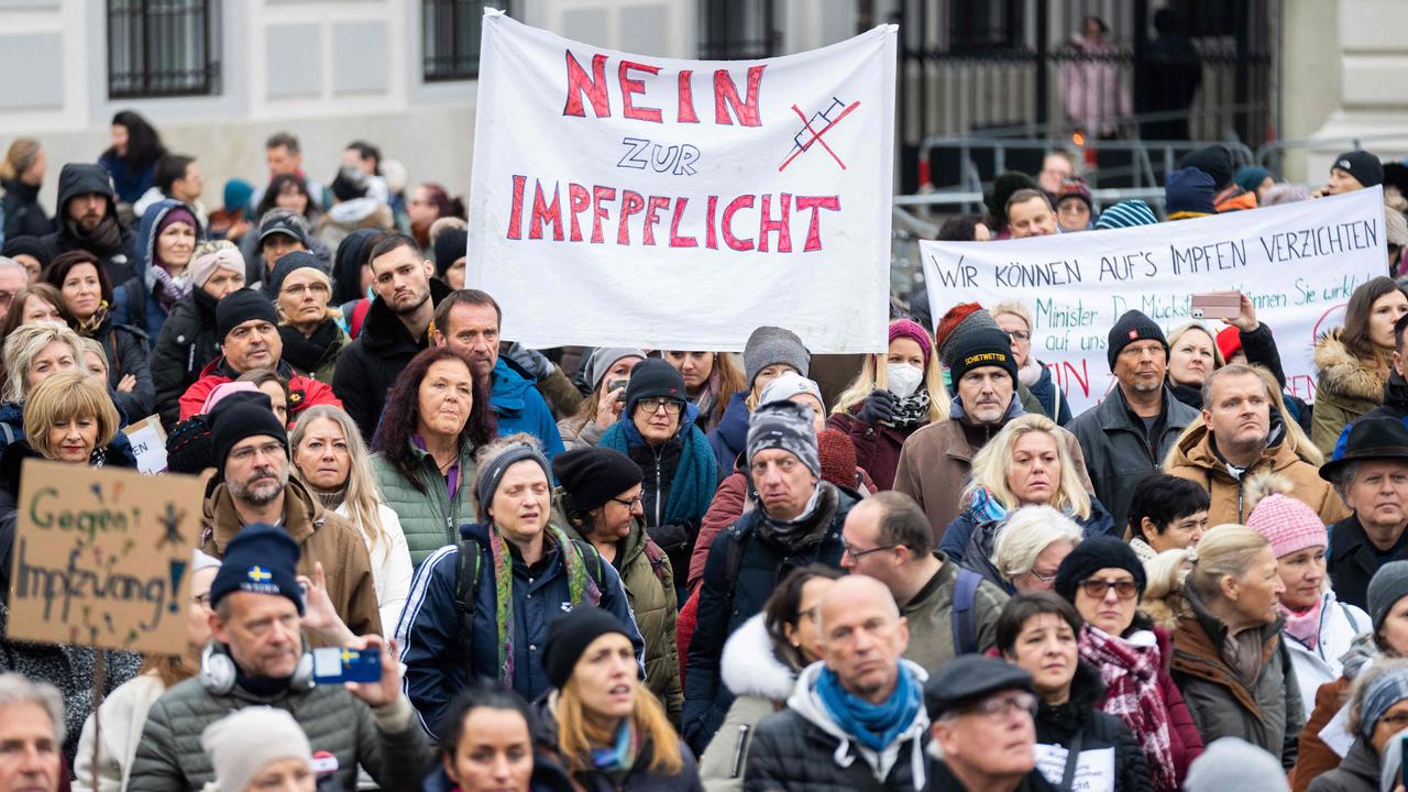 A demonstrator holds a placard reading ‘No to compulsory vaccination’ during an anti-vaccination protest at the Ballhausplatz in Vienna, Austria. Picture: Georg Hochmuth/APA/AFP