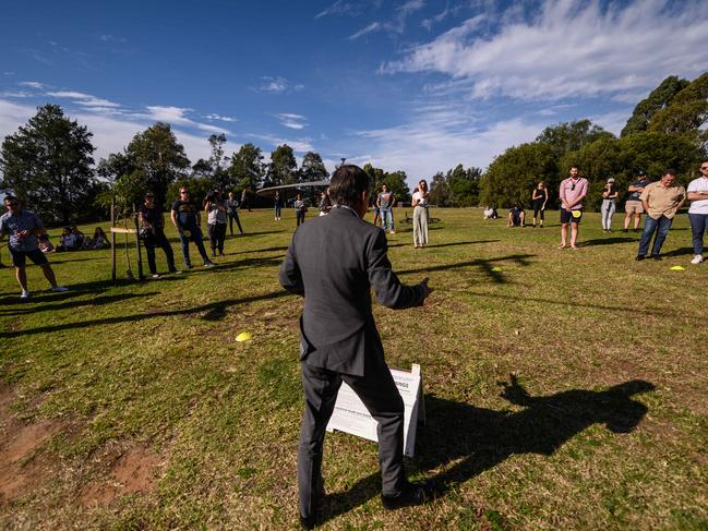 SYDNEY, AUSTRALIA - May 9: Auctioneer James Keenan calling the auction of 3/1 Cardigan Lane, Camperdown. It was sold for $1,231,000 to Christopher Mill (contact number 0420361500) and Michelle Meyer after an auction which was held in a nearby park with social distancing measures. (Photo by James Gourley/The Australian)