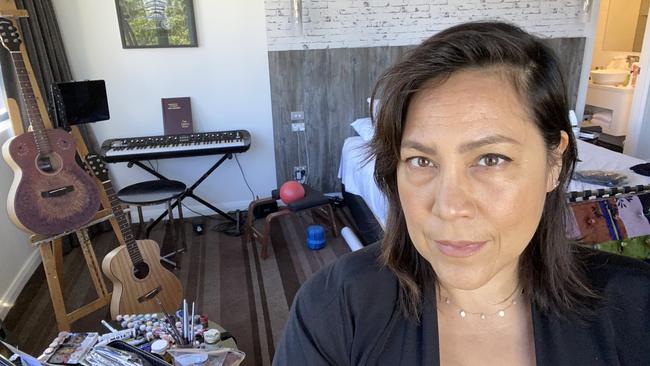 Kate Ceberano takes a selfie in her quarantine hotel, with piano and paints. Picture: Kate Ceberano