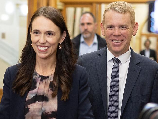 New Zealand Prime Minister Jacinda Ardern (L) and Chris Hipkins arrive at the Labour caucus meeting to elect a new premier at Parliament in Wellington on January 22, 2023. (Photo by Marty MELVILLE / AFP)