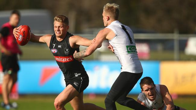 Adam Treloar is challenged by Jaidyn Stephenson at Magpies training Picture: Getty Images