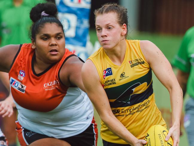 Molly Althouse of the Territory chases down Woodville’s Annie Falkenberg in the NTFL Rep Team vs Woodville-West Torrens at TIO Stadium. Picture: Glenn Campbell;