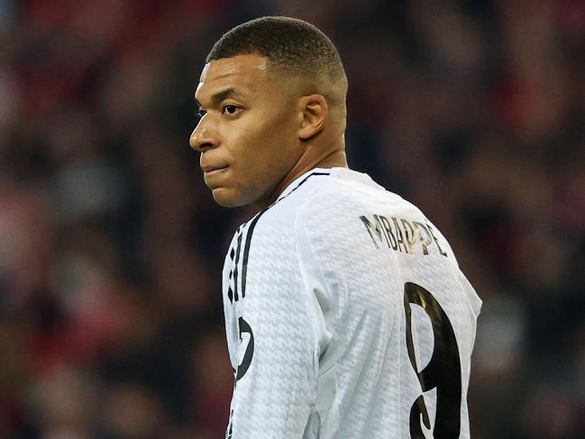 (FILES) Real Madrid's French forward #09 Kylian Mbappe looks on during the UEFA Champions League football match between Lille LOSC and Real Madrid at the Pierre Mauroy Stadium in Villeneuve-d'Ascq, northern France, on October 2, 2024. Kylian Mbappe is being investigated for rape by Swedish police, according to a newspaper report in Sweden following a visit by the Real Madrid star to Stockholm, which Mbappe denounced as "fake news". (Photo by FRANCK FIFE / AFP)