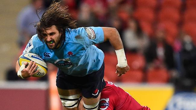 BRISBANE, AUSTRALIA - JULY 12: Jacques Potgieter of the Waratahs is tackled during the round 19 Super Rugby match between the Reds and the Waratahs at Suncorp Stadium on July 12, 2014 in Brisbane, Australia. (Photo by Ian Hitchcock/Getty Images)