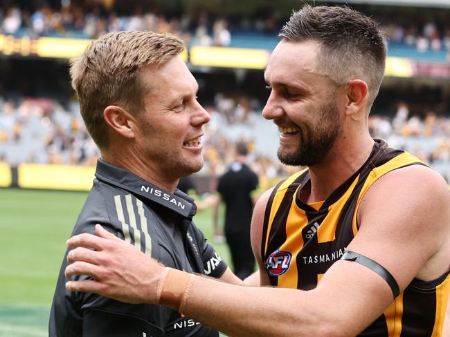 MELBOURNE.  20/03/2022.   AFL. Round 1.  Hawthorn vs North Melbourne at the MCG . .  Sam Mitchell, senior coach of Hawthorn. Hugs Jack Gunston after todays win . Photo by Michael Klein